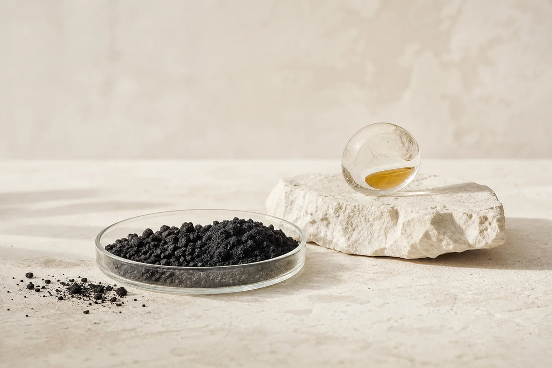 Close-up of raw activated charcoal granules and powder showing porous carbon texture