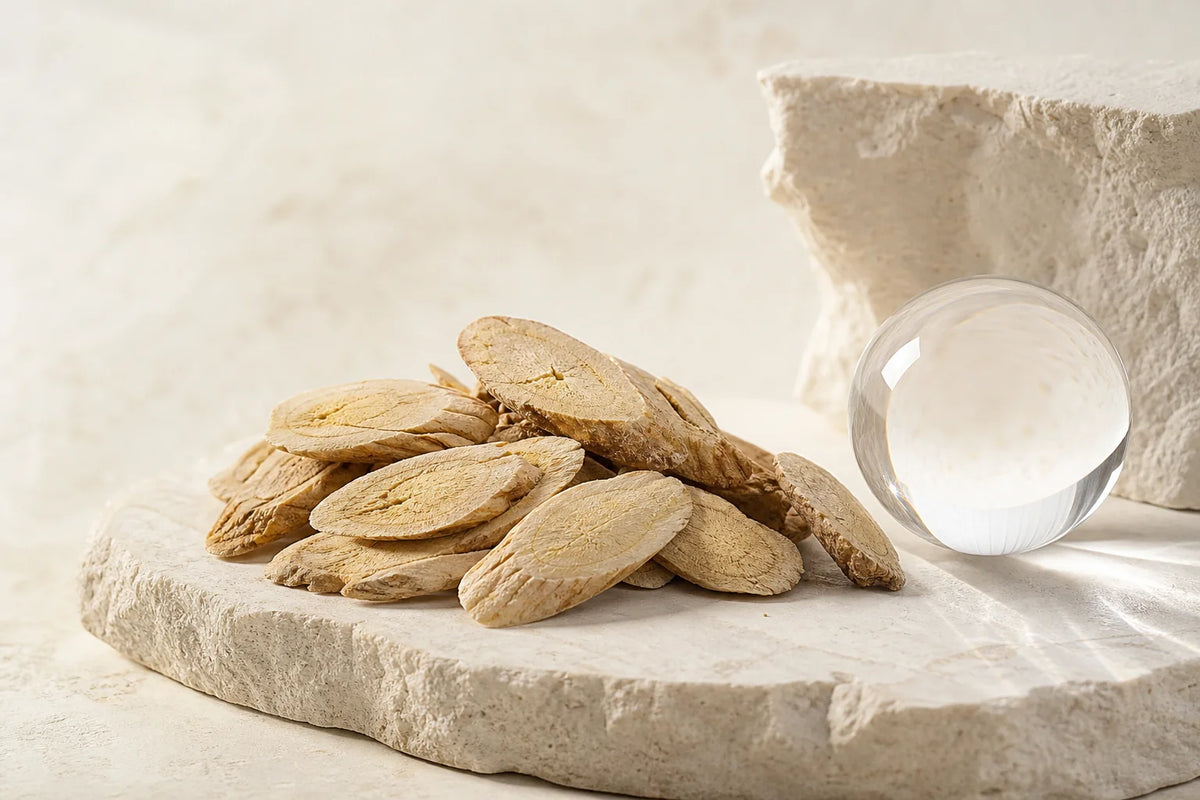 Dried Astragalus membranaceus root slices, the raw botanical material studied in the reviewed research