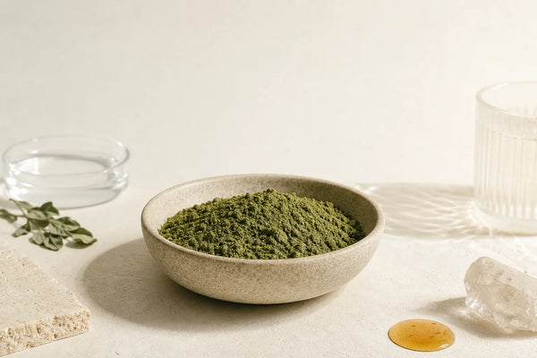 Dried moringa leaf powder in a bowl, representing a botanical supplement ingredient category